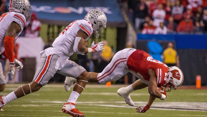 Ohio State held UW freshman sensation Jonathan Taylor to 41 yards in 15 carries during the Big Ten title game on Saturday night.