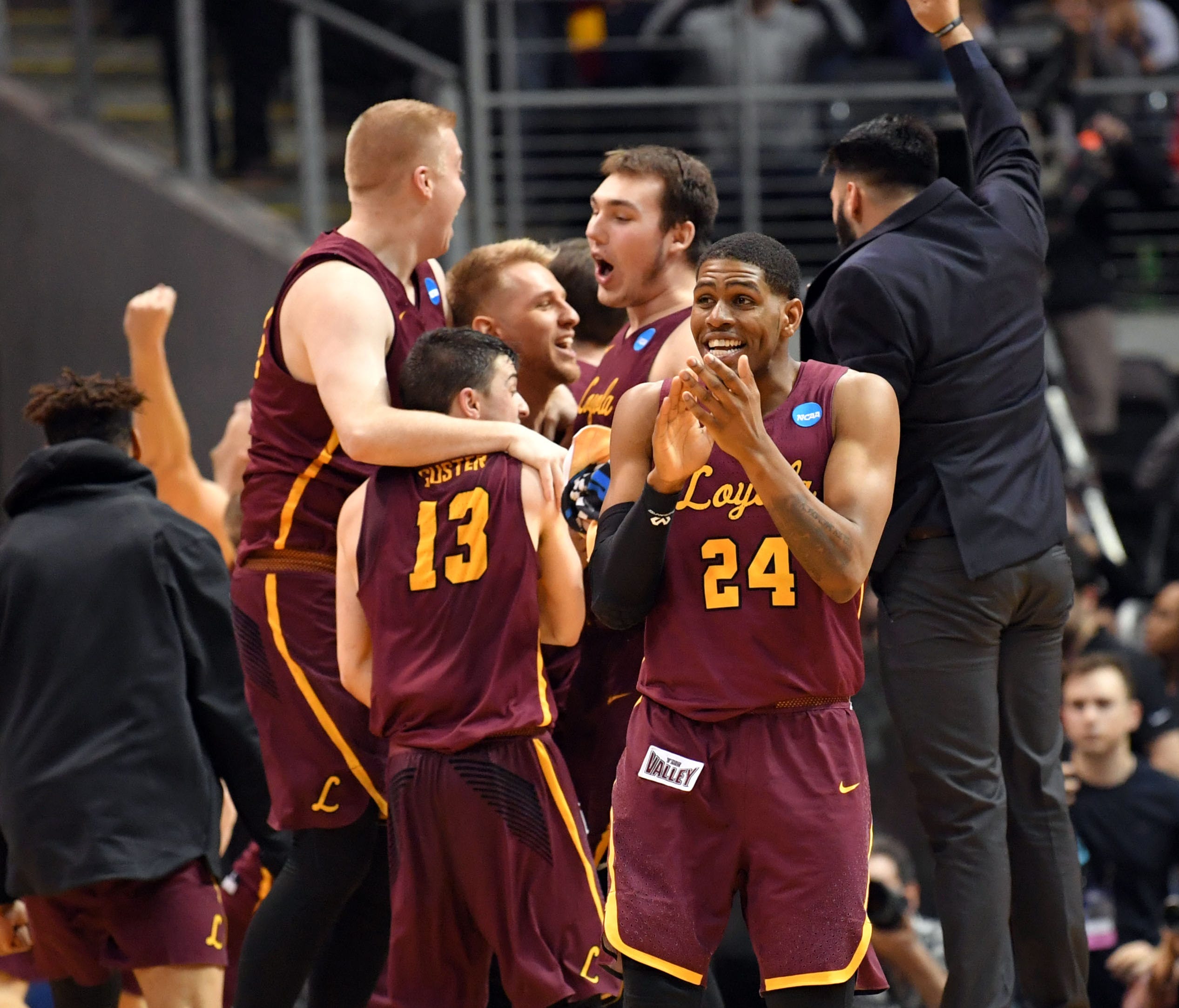 The Loyola Ramblers celebrate after defeating the Kansas State Wildcats in the championship game of the South regional of the 2018 NCAA Tournament at Philips Arena.