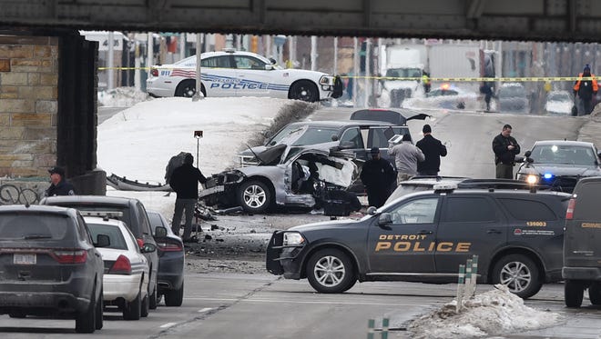 Detroit Police investigators at the scene at Clark Street and Michigan Avenue as a Detroit officer died after an accident on Tuesday February 13, 2018 in Detroit.