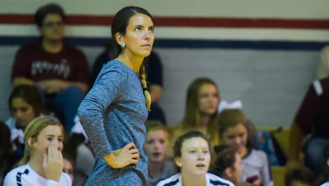 STM volleyball coach Jessica Burke looks on as the Cougars face Teurlings this season.