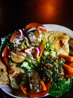 The Vegetarian Sampler at Open Sesame in Des Moines East Village on Wednesday, Dec. 28, 2016, in Des Moines. Available at lunch and dinner, the dish includes hummus, baba ganouj, tabouli, grape leaves, falafel and pita.