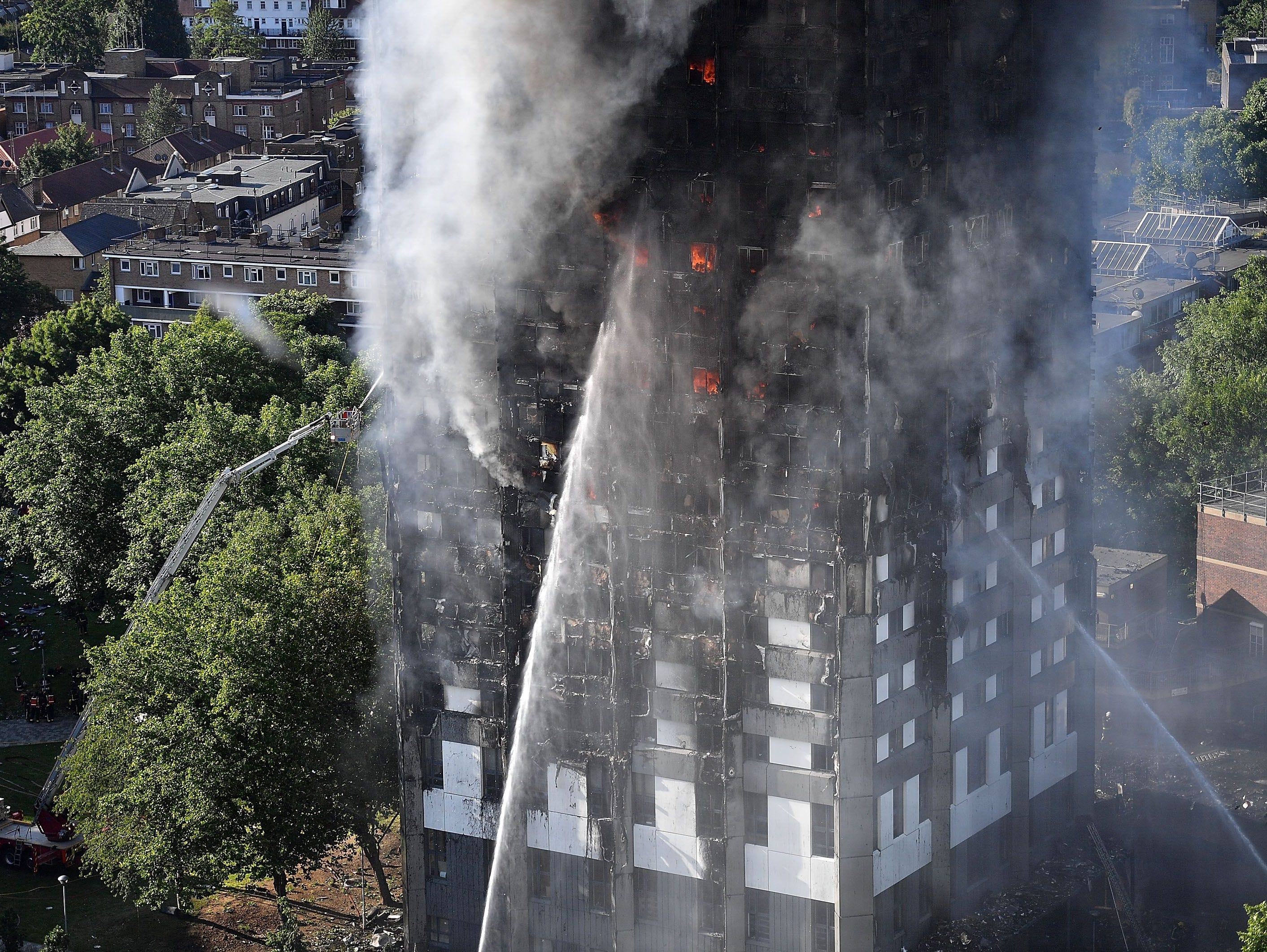 Fire fighters tackle a huge fire that engulfed the 24-story Grenfell Tower in Latimer Road, West London in the early hours of this morning on June 14, 2017 in London, England.