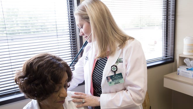 Dr. Leslie Sizmore examines Barbara Salters at Lafayette General Hospital Southwest June 8, 2016.