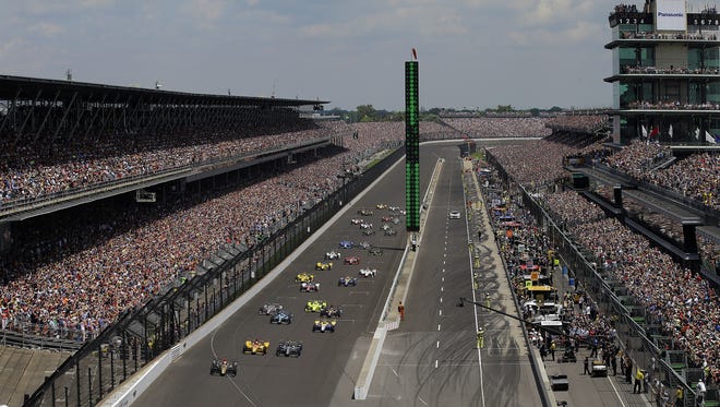 The field of 33 IndyCars take the green light at the start of the 100th running of the Indianapolis 500 Sunday, May 29, 2016, afternoon at the Indianapolis Motor Speedway.