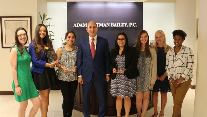 Adam Leitman Bailey, a successful real estate attorney and New Milford High School alumnus, poses with last year's winners of the Raymond "Hap" Harrison scholarship award.