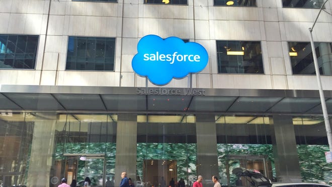 The Salesforce logo above a building entrance.