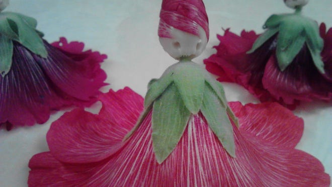Making hollyhock dolls is one way to have fun with plants.
