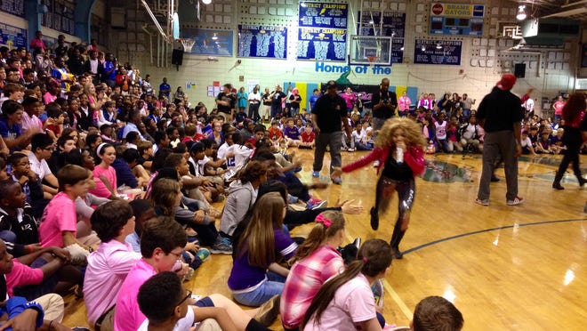
Miesha, member of all-girl teen group Karma, sings and greets students of Scott M. Brame Middle School on Friday. The group out of Memphis, Tenn., incorporates an anti-bullying message into performances. --Leigh Guidry/lguidry@thetowntalk.com
