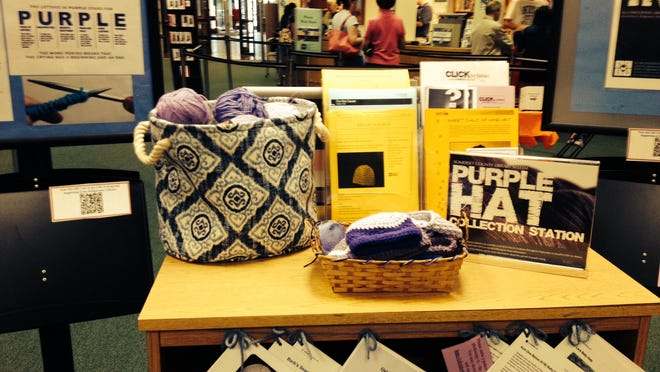 
The collection station at the Bridgewater Public Library offers free patterns and free yarn to anyone who wants to make purple baby hats for the CLICKS for Babies project. 

