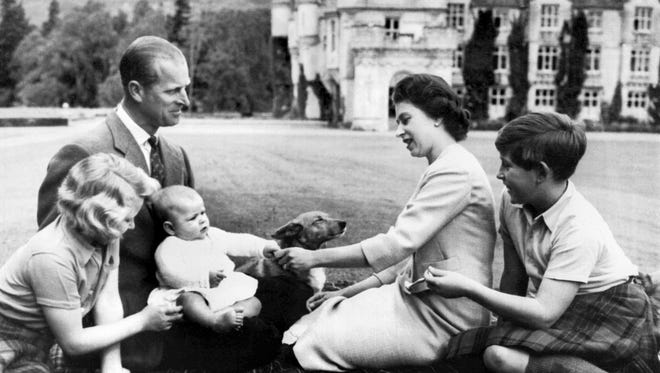 The queen gave birth to two more children after she was crowned, including here, Prince Andrew, in 1960, and Prince Edward in 1964. This photo, with Princess Anne, Prince Philip and Prince Charles and one of her ever-present corgis, was taken on the lawn at Balmoral on September 8, 1960.