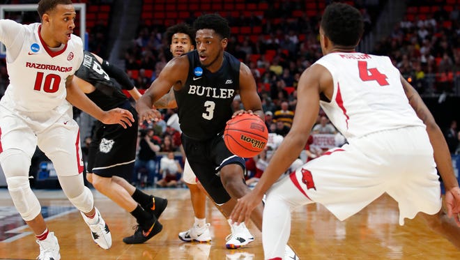 Butler Bulldogs guard Kamar Baldwin (3) moves down the court defended by Arkansas Razorbacks forward Daniel Gafford (10) in the second half  in the first round of the 2018 NCAA Tournament at Little Caesars Arena.