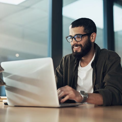 Person typing on a laptop.