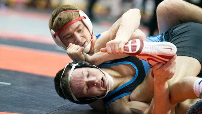 Spring Grove's Dalton Rohrbaugh, top, wrestles Daniel Boone's Samuel Zummo during a 126-pound bout, at the District 3 Class 3A wrestling tournament at the Giant Center in Hershey, Thursday, Feb. 22, 2018. 