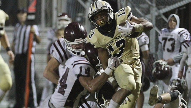 Springfield's D'corion Bryant fights for extra yards during the Yellow Jackets' 20-10 win over Hardin County.