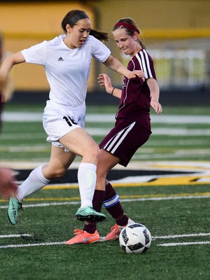 Southeast Polk's Avery Abbas moves the ball down field against Ankeny in a game from 2016.