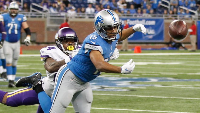 Lions WR Golden Tate reaches for a long pass attempt during their last failed drive in the loss to the Vikings Sunday.
