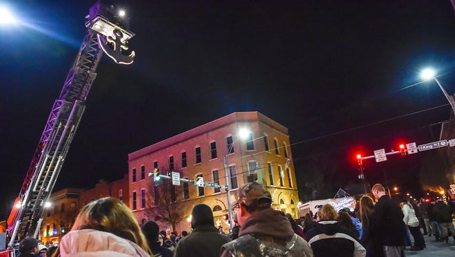 People begin to gather in downtown Shippensburg, Pa. to watch the anchor drop down for the New Years on Dec. 31, 2015.