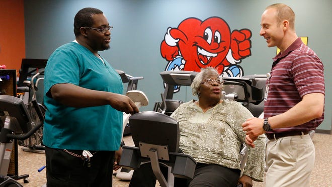 Joseph Hobdy, 30, and his mother Starlette Hobdy, 55, go over her exercise program with Ryan Sorenson, a certified exercise physiologist at Las Palmas LifeCare Center. Hobdy started cardiac rehabilitation at the center in July.