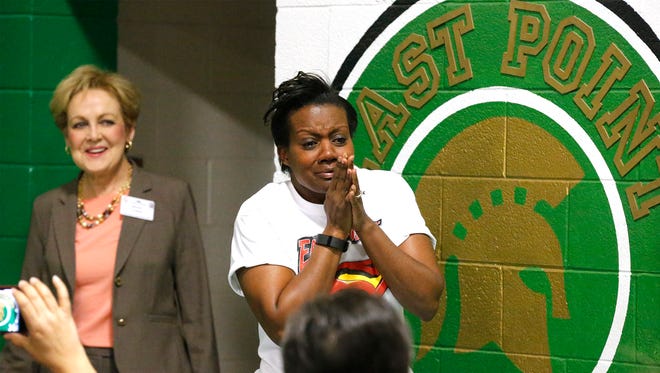 East Point Elementary School Principal Dana Boyd, right, reacts to seeing the entire student body crammed into the school’s gymnasium Friday morning for the announcement that she had been named the 2016 Texas National Distinguished Principal by the Texas Elementary Principals and Supervisors Association. Boyd also received a check for $10,000 courtesy of Mentoring Minds a longtime business supporter of the association.