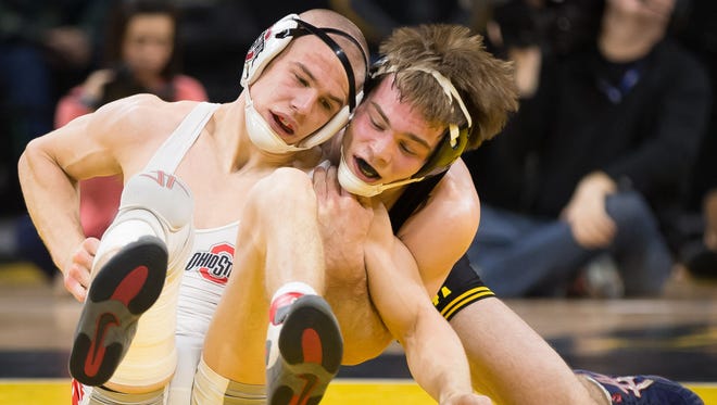 Brandon Sorensen of Iowa, right, seen in a file photo, clinched a University Nationals championship Sunday in Akron, Ohio.