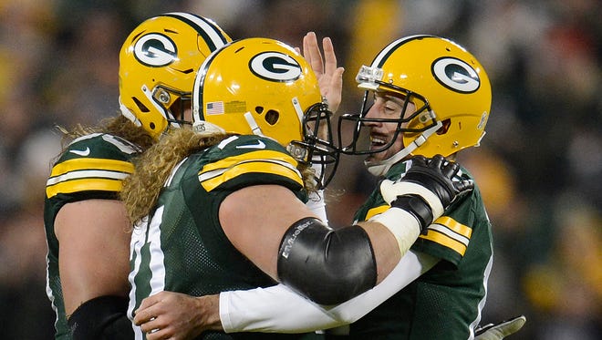 Green Bay Packers quarterback Aaron Rodgers (12), right, celebrates a touchdown with offensive lineman Josh Sitton (71) against the Chicago Bears.