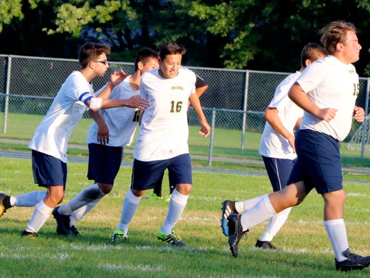 David Guerra, No. 16, is congratulated by his Saddle
