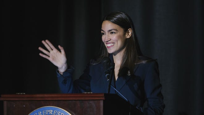 Rep. Alexandria Ocasio-Cortez, D-N.Y., delivers her inaugural address following her swearing-in ceremony at the Renaissance School for Musical Theater and Technology in the Bronx borough of New York on Saturday, Feb. 16, 2019.