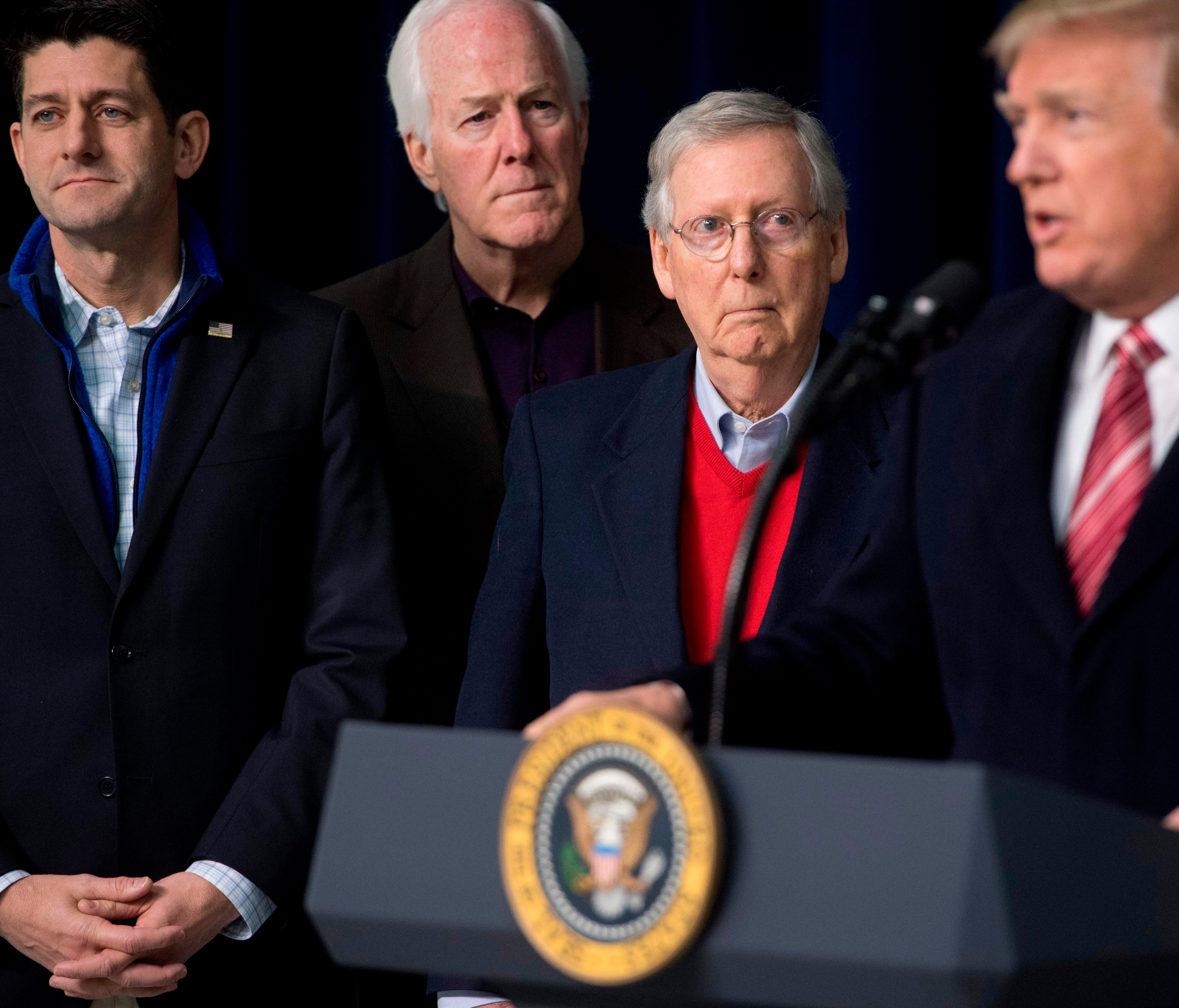 US President Donald Trump speaks alongside Speaker of the House Paul Ryan, R-Wis., (L), Senate Majority Whip John Cornyn, R-Texas, (2nd L) and Senate Majority Leader Mitch McConnell, R-Ky., (C) during a retreat with Republican lawmakers and members o