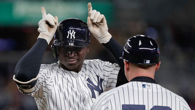 New York Yankees' Didi Gregorius motions to the dugout after hitting a single against the Minnesota Twins during the seventh inning of a baseball game Tuesday, April 24, 2018, in New York.