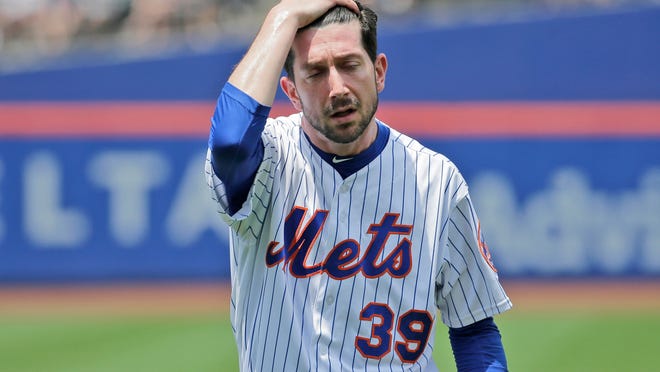New York Mets pitcher Jerry Blevins leaves the field after the top of the first inning of a baseball game against the Los Angeles Dodgers at Citi Field, Sunday, June 24, 2018, in New York. (AP Photo/Seth Wenig)