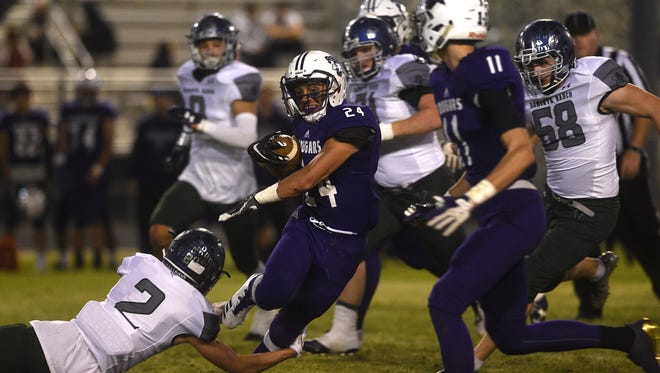 Spanish Springs' Gabby Ordaz (24) tries to break a tackle while taking on Damonte Ranch during their football game at Spanish Springs on Sept. 15.