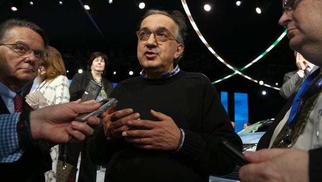 Sergio Marchionne the CEO of Fiat Chrysler Automobiles talks with a few members of the media at the 2016 North American International Auto Show at Joe Louis Arena in downtown Detroit on Monday, Jan. 11, 2016. 
Eric Seals/Detroit Free Press