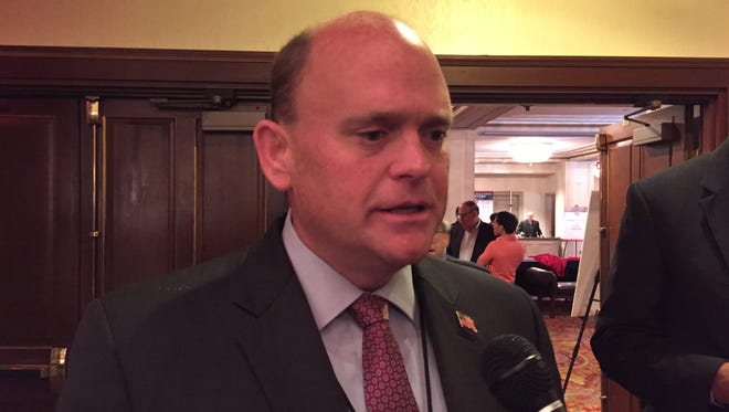 Rep. Tom Reed, R-Corning, talks to reporters Wednesday at a breakfast hosted by New York delegates to the Republican National Convention in Cleveland. Reed's campaign committee was a sponsor that helped underwrite the cost of the breakfast.