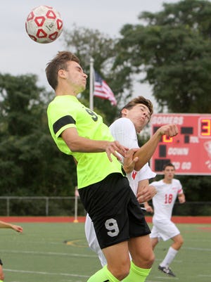 Lakeland's Matias Prando, left, and Somers' Alex Elconin battle for ball control during their game at Somers High School on Wednesday, The Hornets won the game 2-1 in overtime.