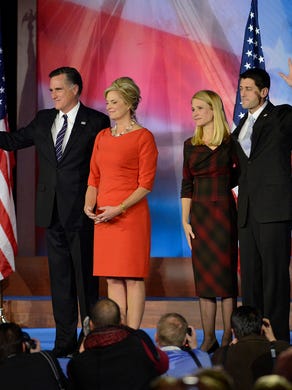Mitt Romney, his wife, Ann, and Paul Ryan and his wife, Janna, gather on stage after giving a concession speech on election night at the Boston Convention &amp; Exhibition Center on Nov. 6, 2012.