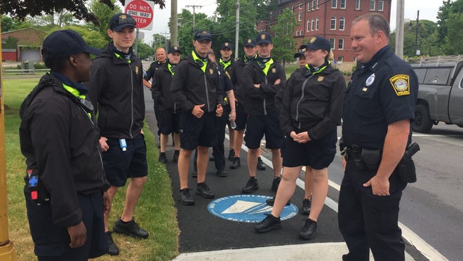 BPD Officer Scott Leger, right, Sgt. Eric Drifmeyer and the CSOs walk their beat around Barnstable Town Hall on Monday, their first day on the job this summer.