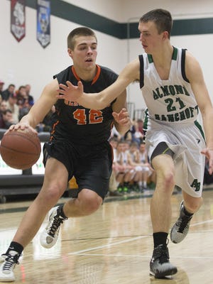 Port Edwards' Jared Joslin goes against Almond-Bancroft's Allan Zinda during a Central Wisconsin Conference basketball game at Almond-Bancroft High School, Thursday, Feb. 11, 2016. Almond-Bancroft defeated Port Edwards in overtime 53-47.