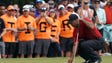 Tiger Woods lines up his putt on the 13th during the