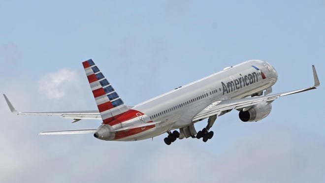FILE - In this Friday, June 3, 2016, file photo, an American Airlines passenger jet takes off from Miami International Airport in Miami. Qatar Airways is attempting to buy a 10 percent stake in American Airlines, triggering U.S. antitrust oversight over deals of such size. American said in a regulatory filing Thursday, June 22, 2017, that the bid was unsolicited, but that there have been conversations between the CEOs of both airlines. (AP Photo/Alan Diaz, File)