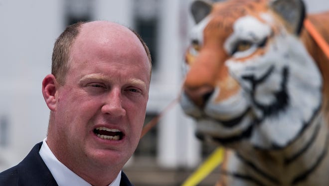 Lt. Gov. candidate Will Ainsworth holds a news conference at the State Capitol on Monday July 16, 2018 with a fiberglass tiger and a boat in response to campaign attacks by his opponent Twinkle Cavanaugh.
