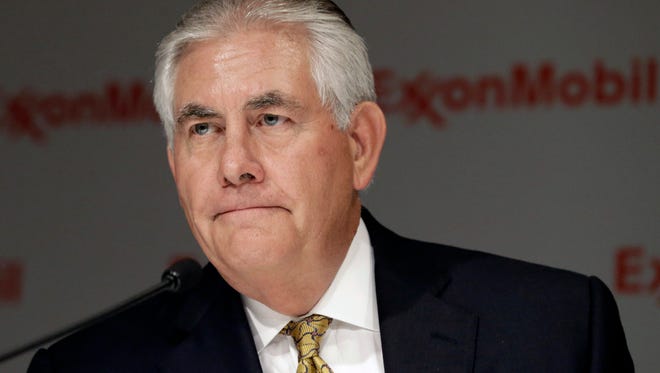 FILE - In this May 28, 2014 file photo, ExxonMobil CEO Rex Tillerson listens to a reporter's question after the annual meeting ExxonMobil shareholders meeting in Dallas. Tillerson on Wednesday, March 4, 2015 said he expects the price of oil to remain low over the next two years because of ample global supplies and relatively weak economic growth (AP Photo/LM Otero, File)