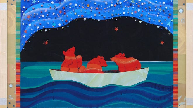 
 “Red Bears and Galaxy,” by fiber artist Char Bickel, features stars made of embroidery, beads and silk. 
