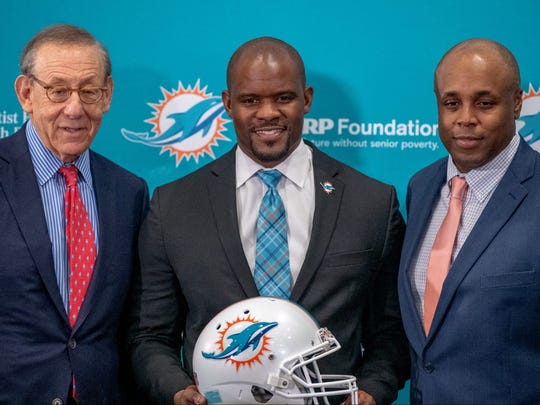 DAVIE, FL - FEBRUARY 04: Stephen Ross Chairman & Owner, Brian Flores Head Coach, Chris Grier General Manager of the Miami Dolphins pose for the media after announcing Brian Flores as their new Head Coach at Baptist Health Training Facility at Nova Southern University on February 4, 2019 in Davie, Florida. (Photo by Mark Brown/Getty Images)