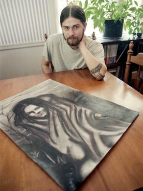 West High School senior and artist Travis DeRocher in May 1996.