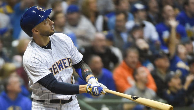 Ryan Braun of the Brewers watches his two-run home run leave the yard during the fourth inning against the Marlins on Friday night.