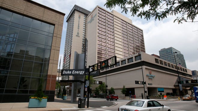 Downtown’s Duke Energy Center, left, and the Millennium Hotel would be important sites for hosting a convention. But the Millennium needs significant upgrades.