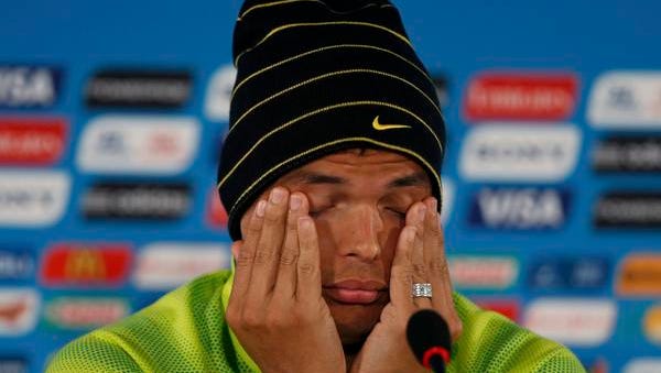 Brazil's Thiago Silva pauses during a news conference in Brasilia on Friday, the day before Brazil plays the Netherlands  for third place at the 2014 World Cup.