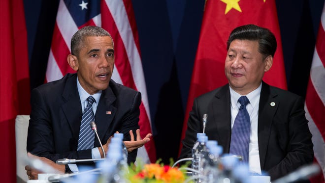 In this photo taken Nov. 30, 2015, President Barack Obama meets with Chinese President Xi Jinping in Le Bourget, France.