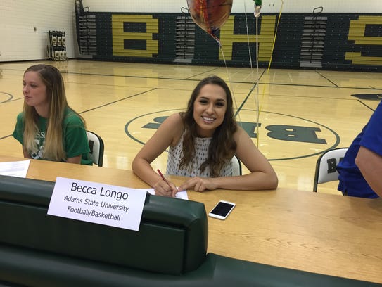 Chandler Basha kicker Becca Longo signs her letter
