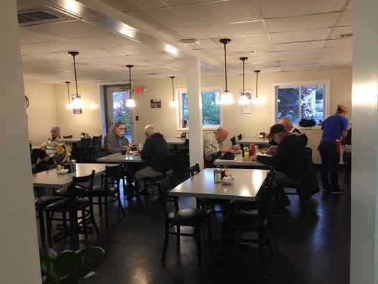 The early morning crowd at the Hi-Hat Cafe has breakfast